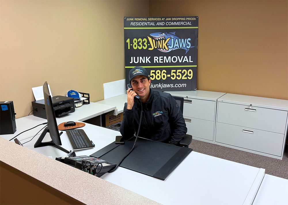 Joe answers the Junk Jaws office phone.