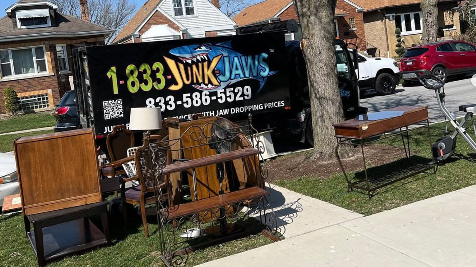 Junk Jaws crew loading unwanted items during a Chicago junk removal job.