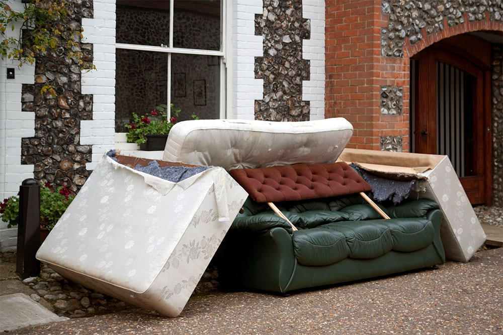 Mattresses stacked for removal.